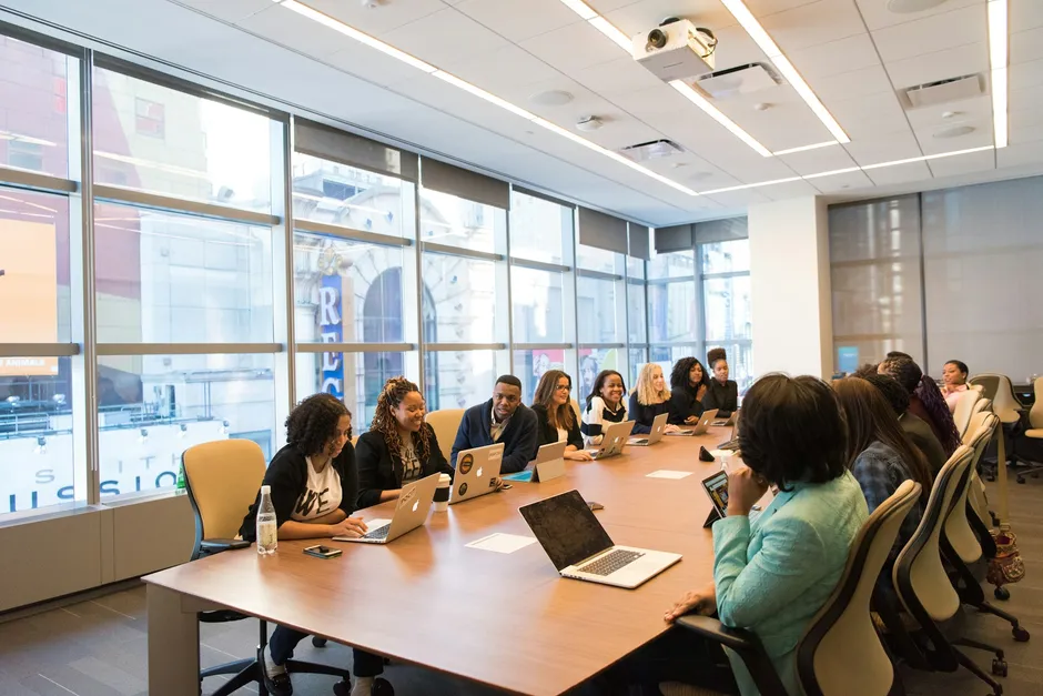 Colleagues reviewing performance data together around a meeting table